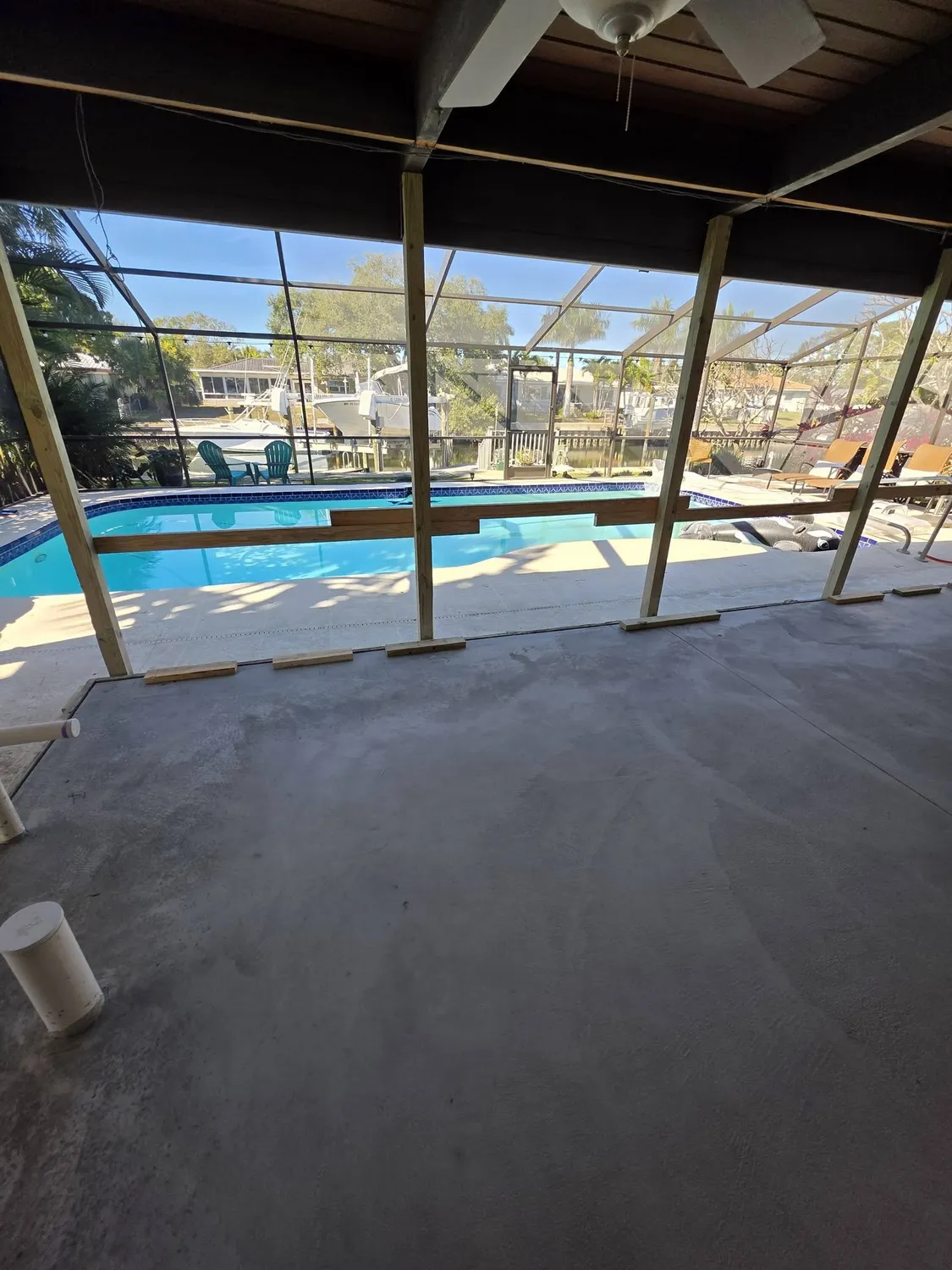 Pool screen enclosure with paver decking on a Manatee County outdoor living project