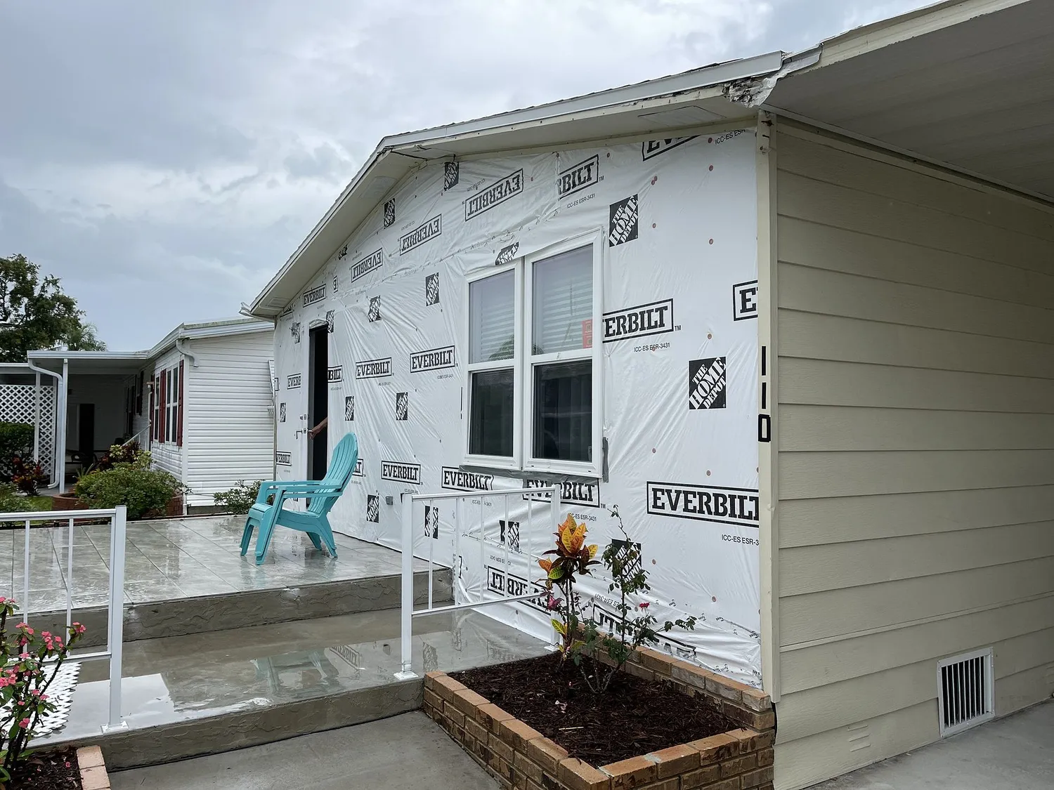 House-wrap weather barrier installed on an exterior wall before new siding goes up